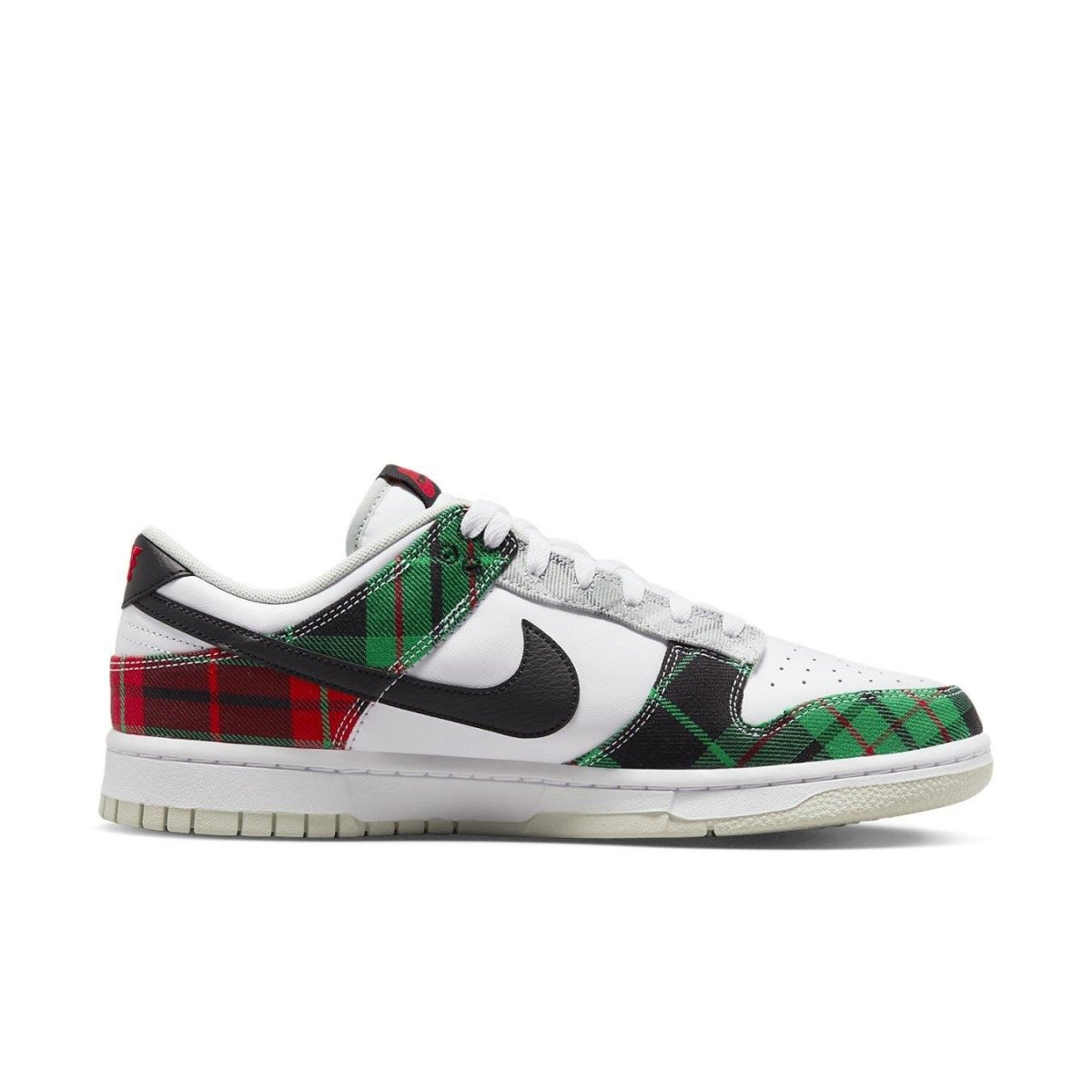 Nike Dunk Low Tartan plaid sneakers in green, black, and red check pattern with white leather accents.
