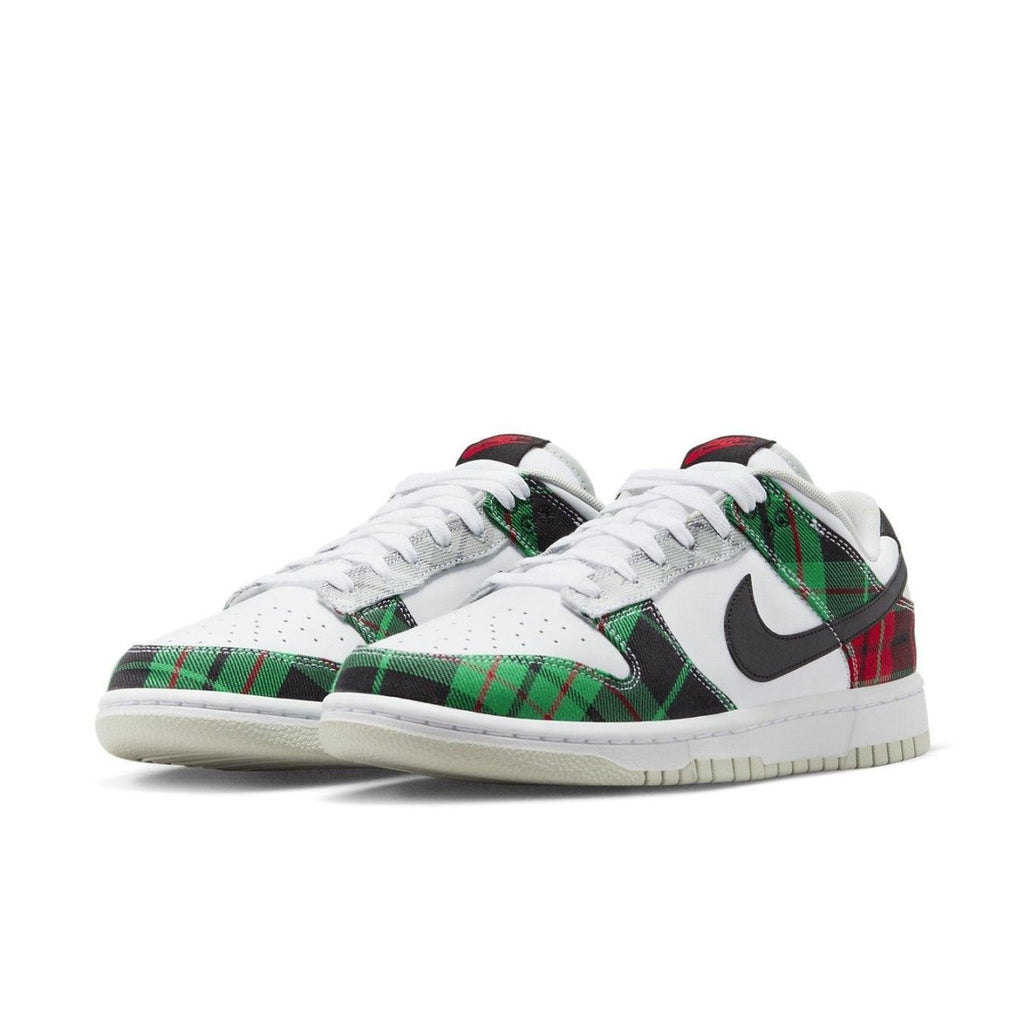Nike Dunk Low Tartan Plaid featuring green, black, and red plaid patterns on a white sneaker.