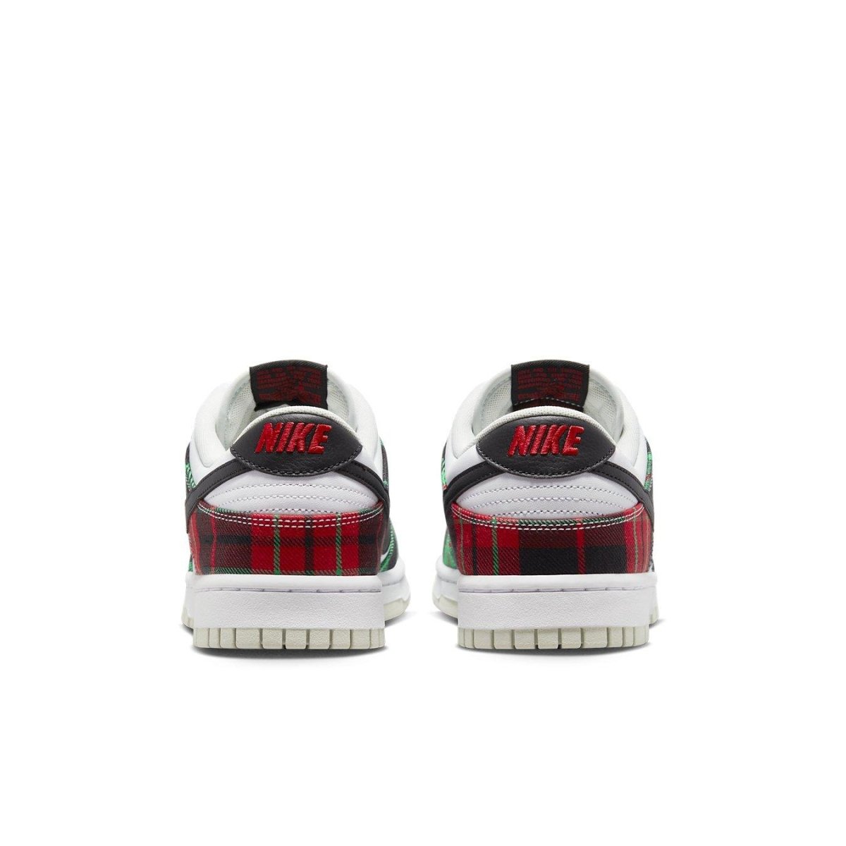 Nike Dunk Low Tartan Plaid sneakers featuring red and green plaid print on the heel and black accents.