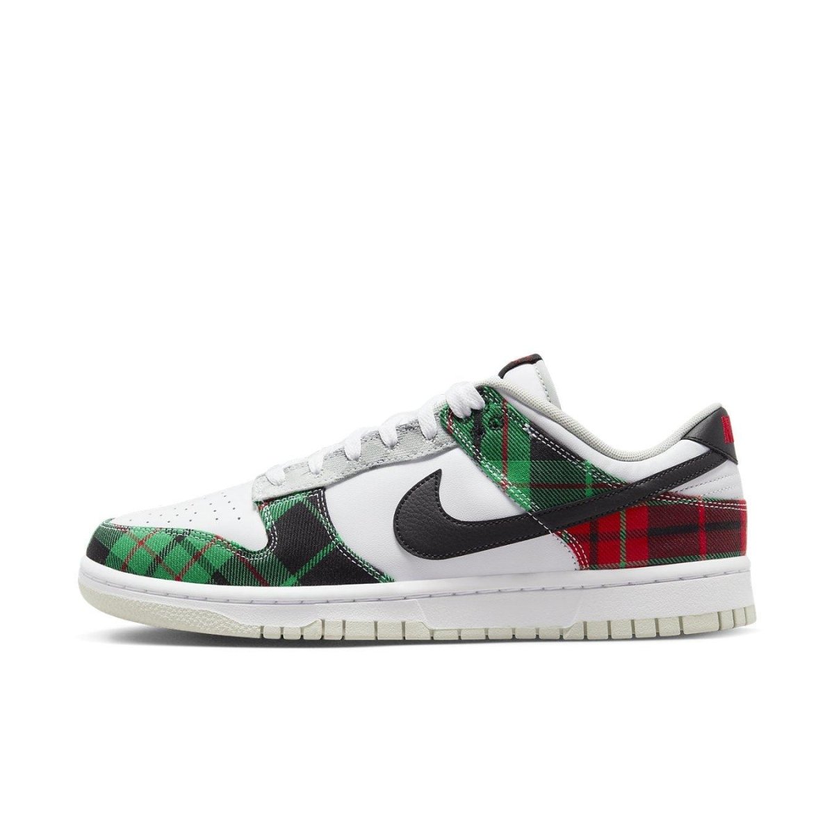 Nike Dunk Low Tartan Plaid with green, black, and red check pattern on a white leather base.