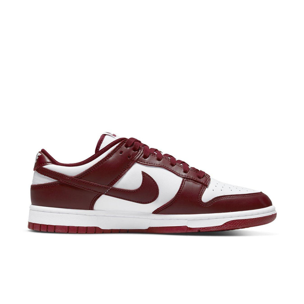 Nike Dunk Low Team Red sneaker in white and team red colorway, featuring classic design and leather upper.