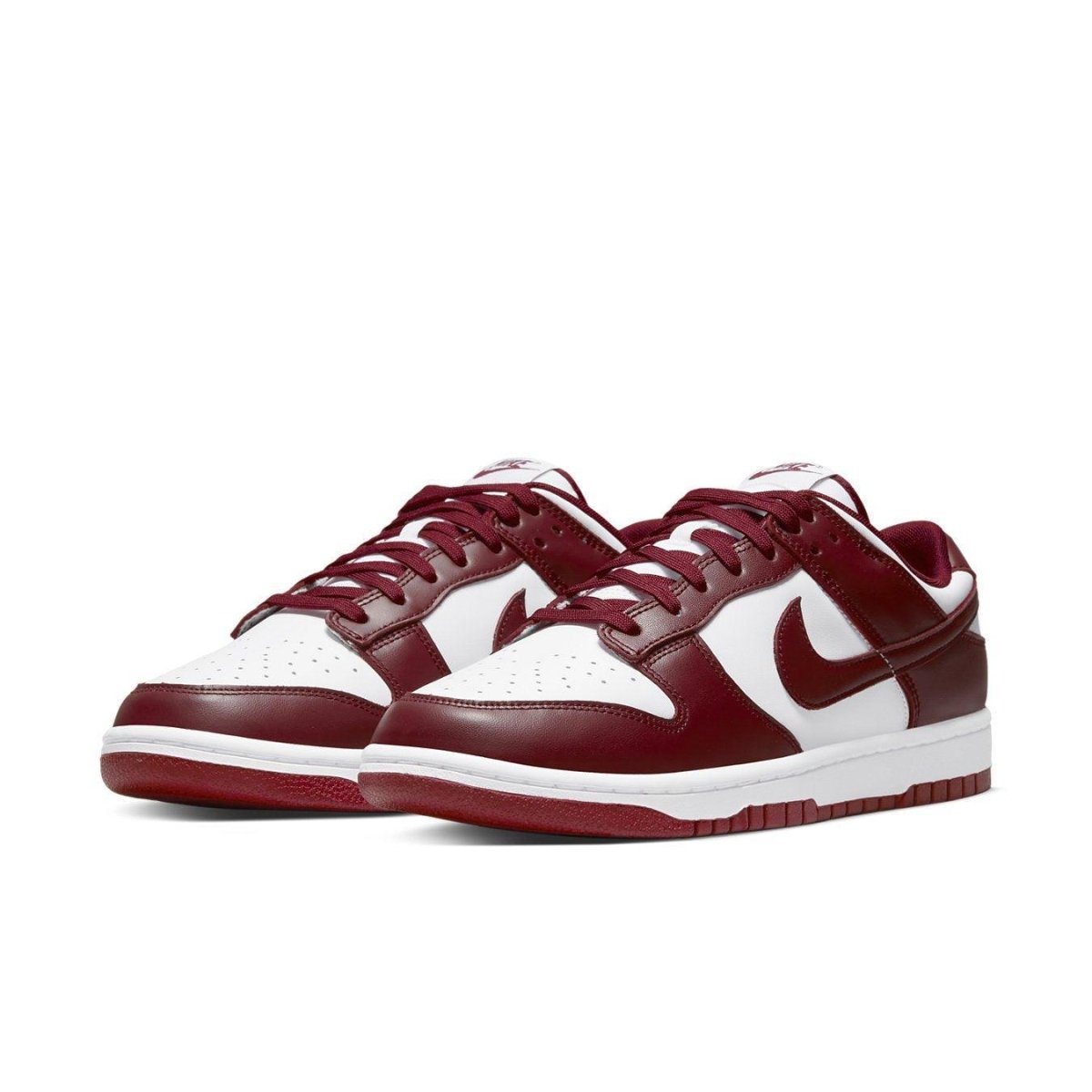 Nike Dunk Low Team Red sneakers featuring white leather and burgundy overlays, classic 1985 design.
