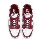 Nike Dunk Low Team Red sneakers featuring white leather base and deep red accents, showcasing classic 1985 style.