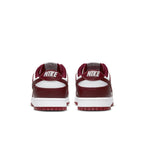 Retro Nike Dunk Low Team Red sneaker with white base and burgundy overlays, featuring embroidered Nike branding on heel.