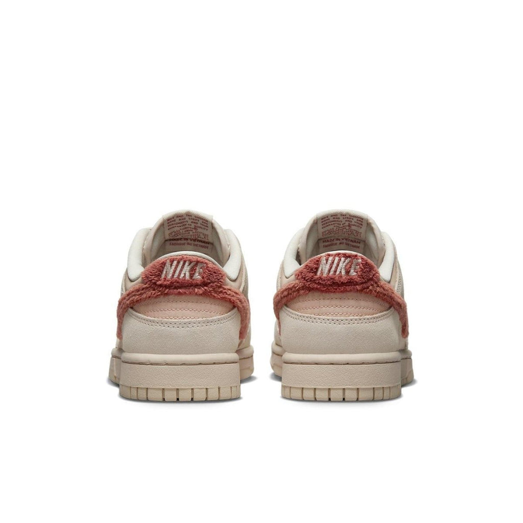 Rear view of women's Nike Dunk Low Terry Swoosh in beige with distinctive terry material accents.