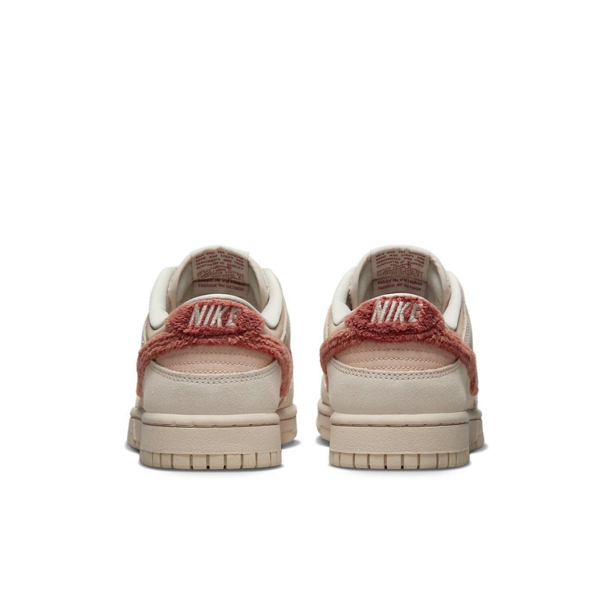 Rear view of women's Nike Dunk Low Terry Swoosh in beige with distinctive terry material accents.