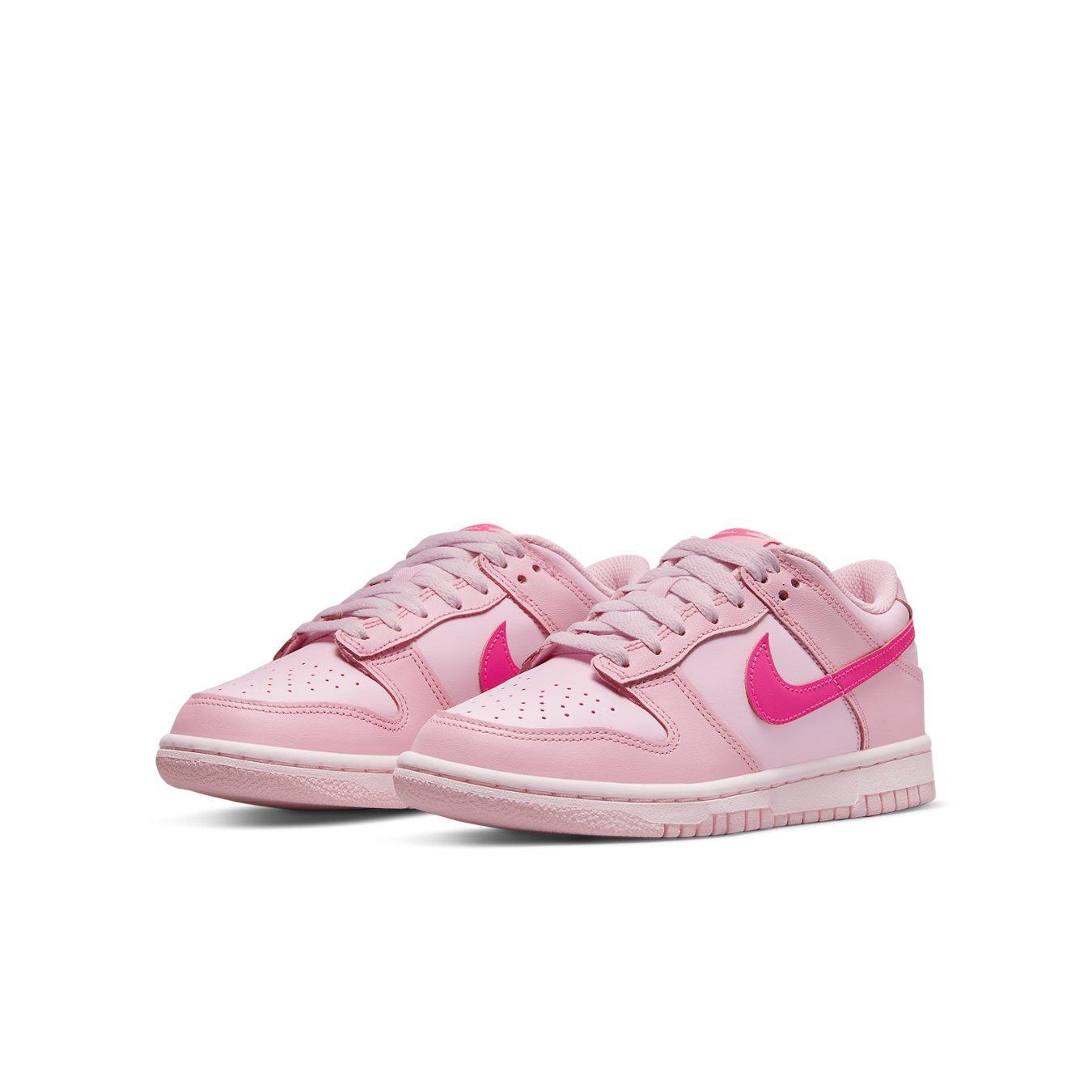 Nike Dunk Low Triple Pink GS sneakers featuring multiple shades of pink and signature Swoosh logo.