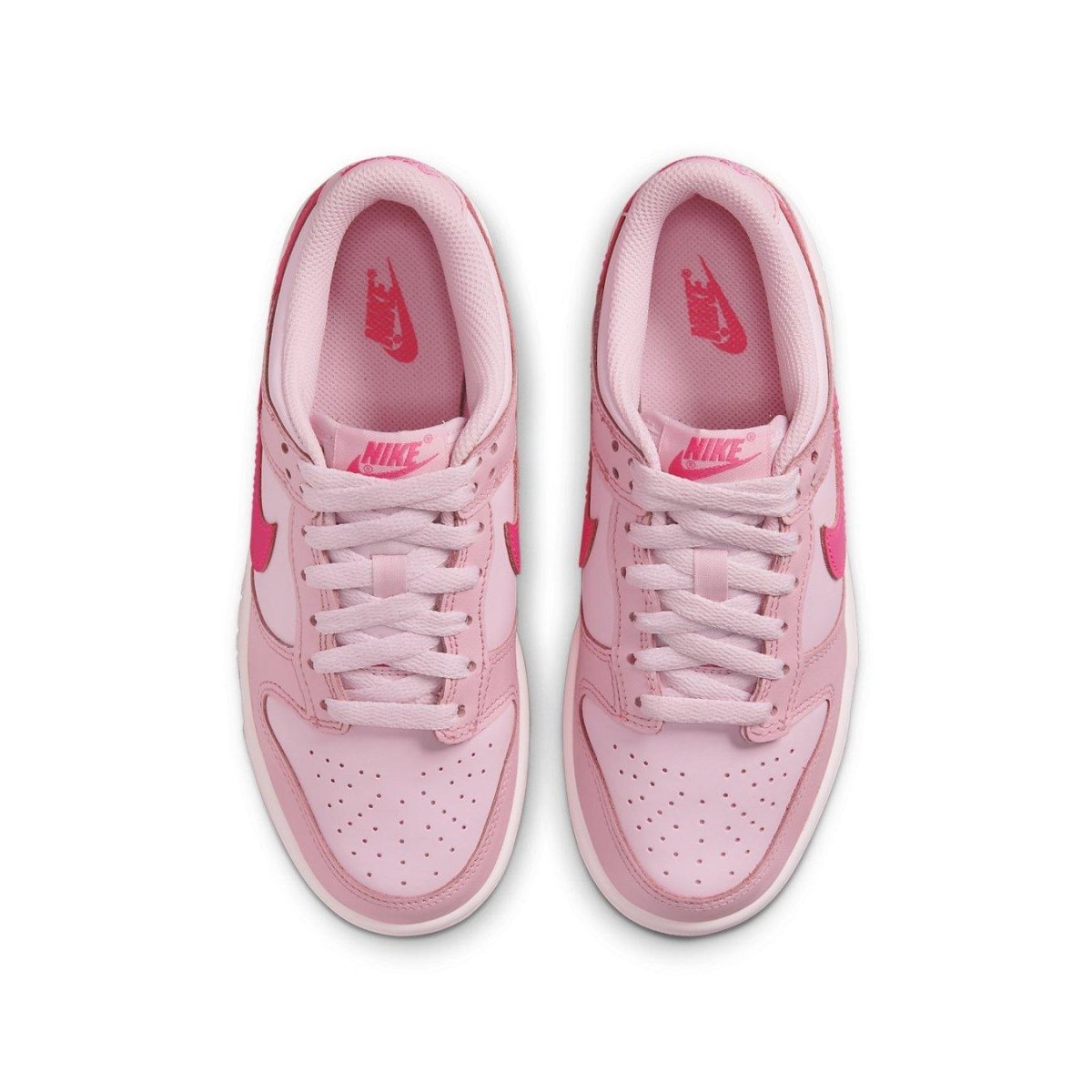 Nike Dunk Low Triple Pink GS sneaker with light and dark pink shades, featuring bold Hyper Pink Swooshes.