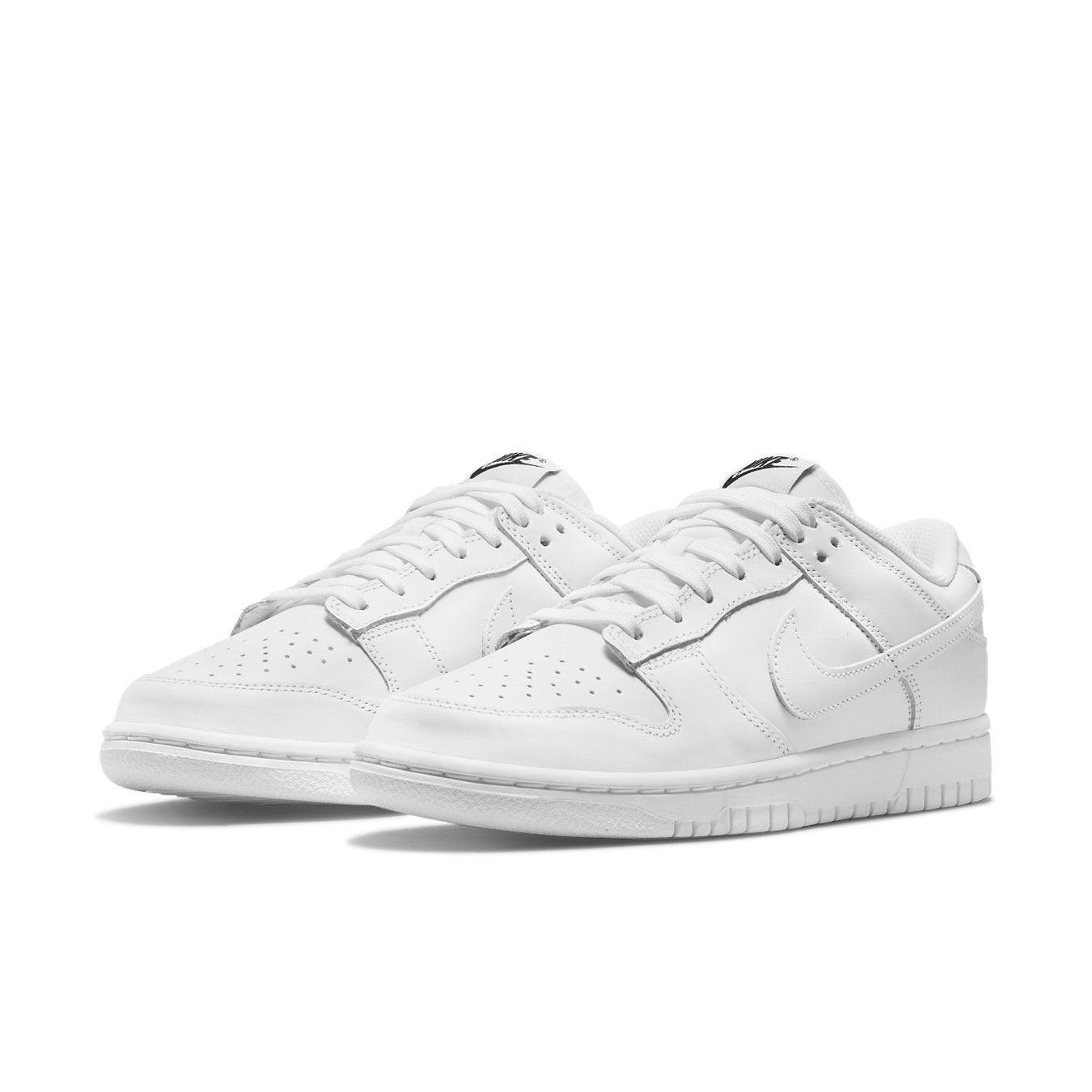 Nike Dunk Low Triple White (2021) women's sneakers with a minimalist white leather design.