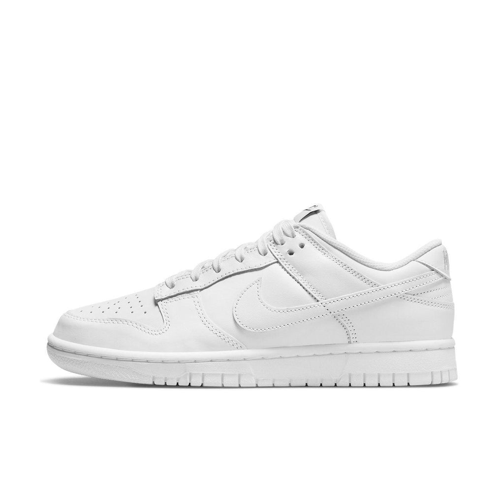 Nike Dunk Low Triple White (2021) women's sneaker showcasing a sleek, all-white design and minimalist style.