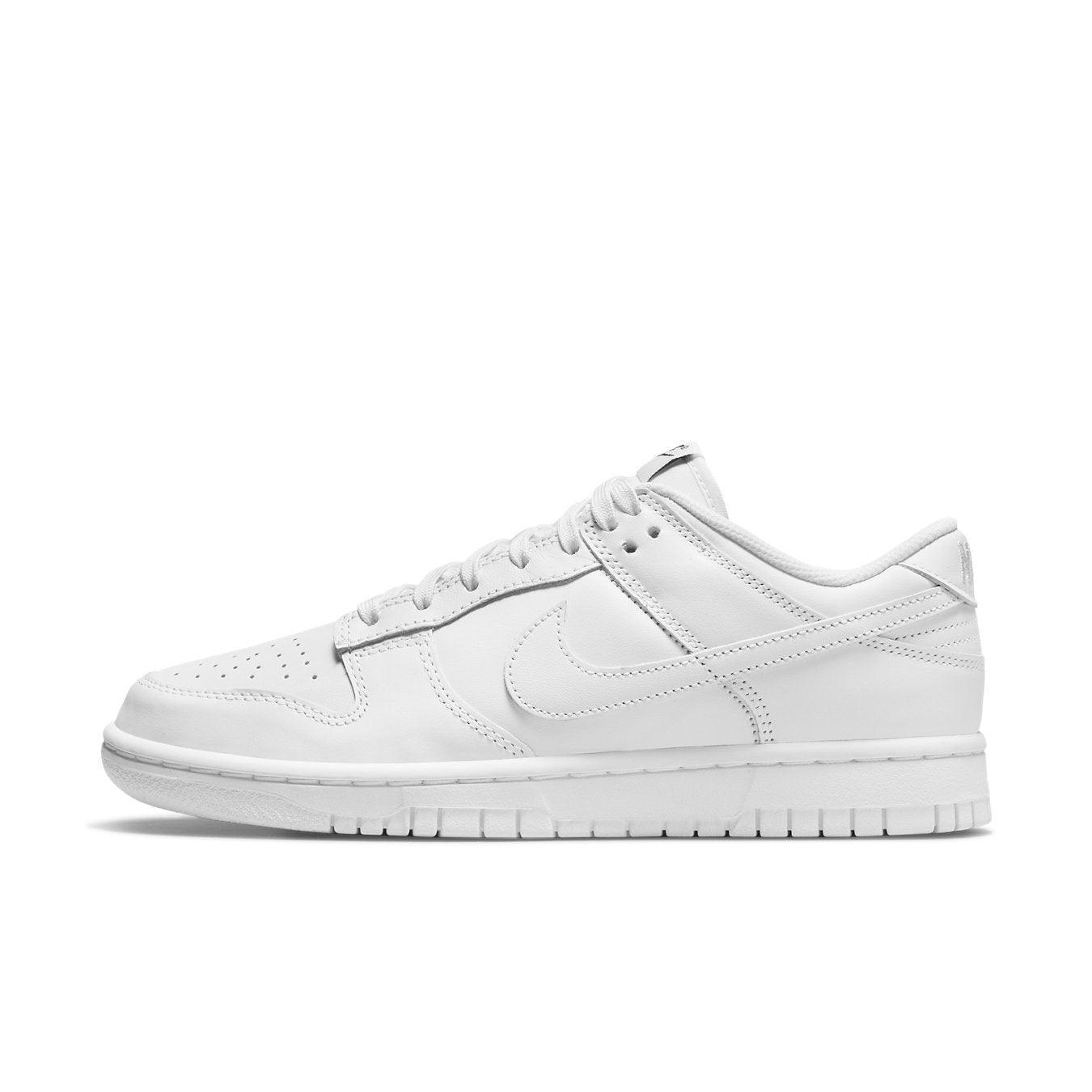 Nike Dunk Low Triple White (2021) women's sneaker showcasing a sleek, all-white design and minimalist style.