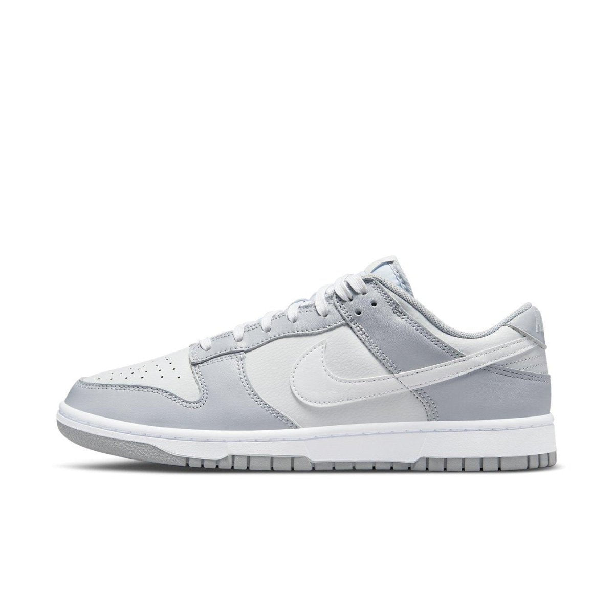 Nike Dunk Low Two Tone Grey sneaker featuring white leather with grey overlays and classic Swoosh design.