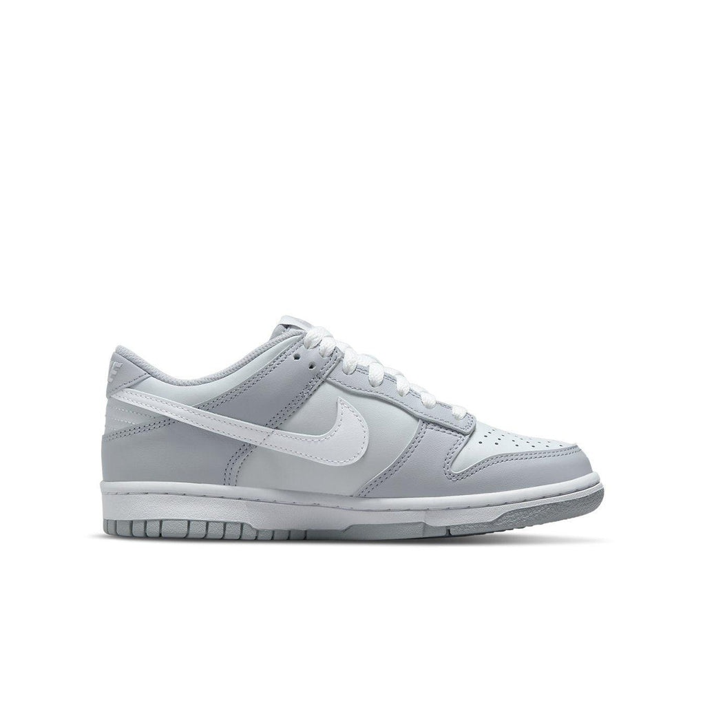 Nike Dunk Low Two-Toned Grey GS featuring light and Wolf Grey tones with white Swoosh and laces.
