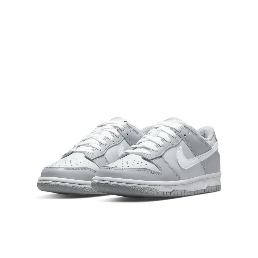 Nike Dunk Low Two-Toned Grey GS featuring light grey and Wolf Grey tones with white Swoosh and laces.