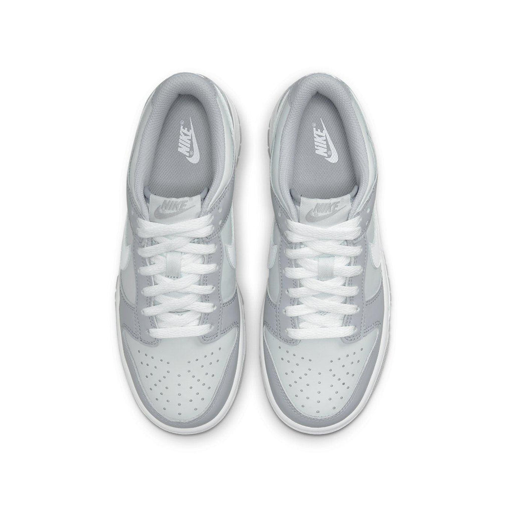 Nike Dunk Low Two-Toned Grey (GS) sneakers with grey upper and white Swoosh design.