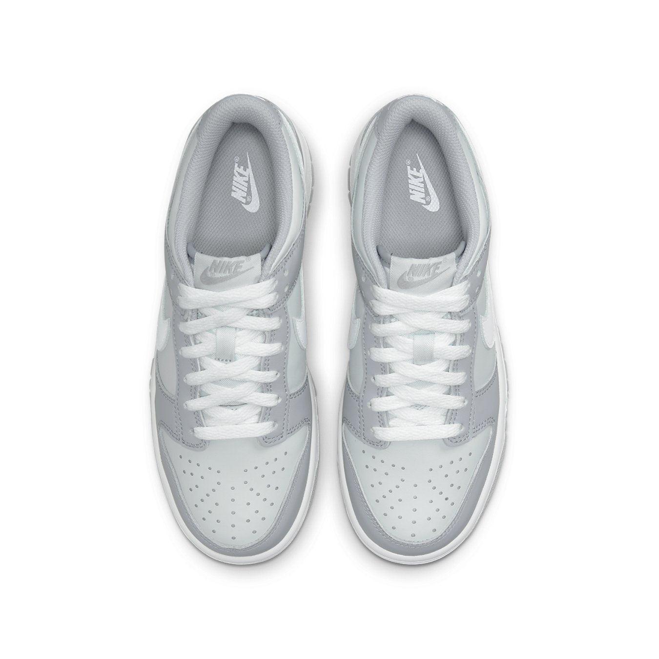 Nike Dunk Low Two-Toned Grey (GS) sneakers with grey upper and white Swoosh design.