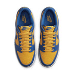 Nike Dunk Low UCLA sneakers in vibrant yellow and blue, featuring Swoosh logo and classic lace-up design.