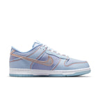 Nike Dunk Low Union Passport Pack Argon in blue with orange accents, inspired by 90s streetwear and global culture.