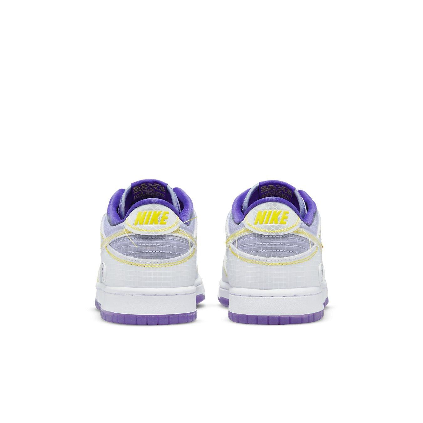 Nike Dunk Low Union 'Court Purple' sneakers, featuring a purple and white colorway at the heel.
