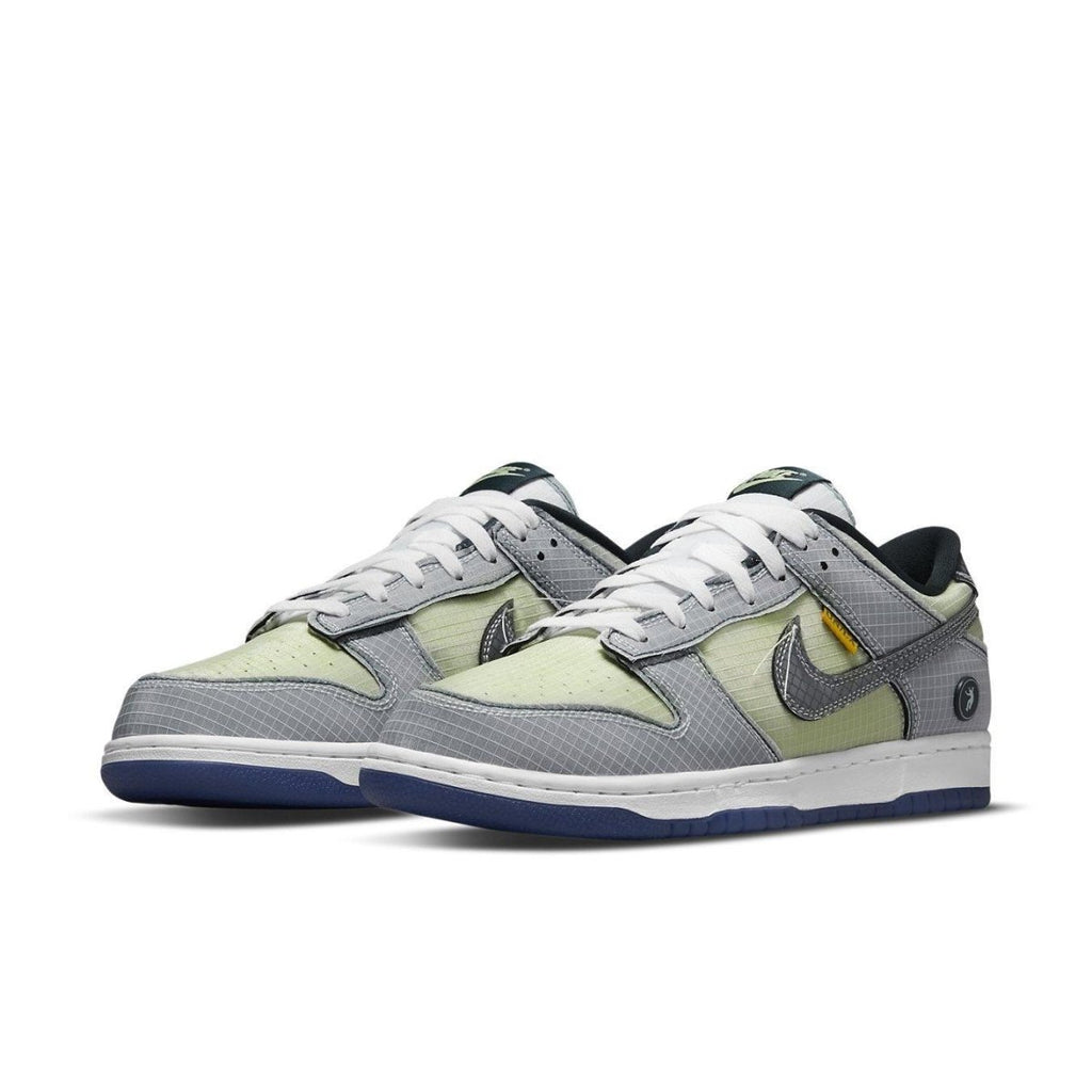 Nike Dunk Low Union Passport Pack Pistachio sneakers in gray and pistachio green, showcasing modern streetwear style.