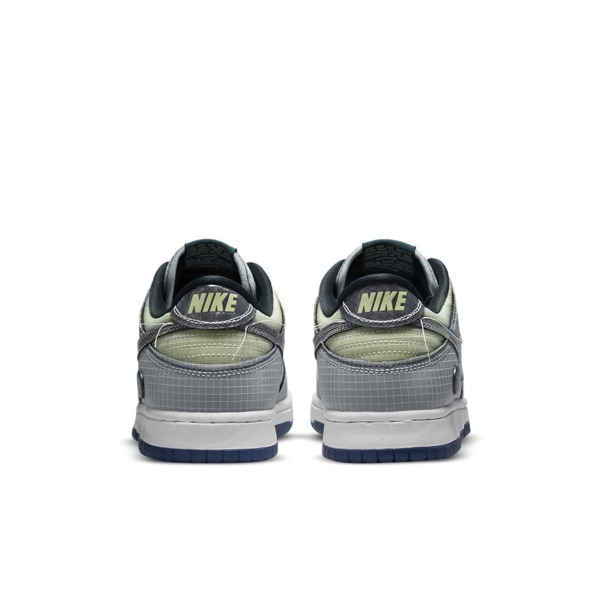 Nike Dunk Low Union Passport Pack Pistachio sneaker back view, featuring grey and pistachio color scheme with Nike branding.