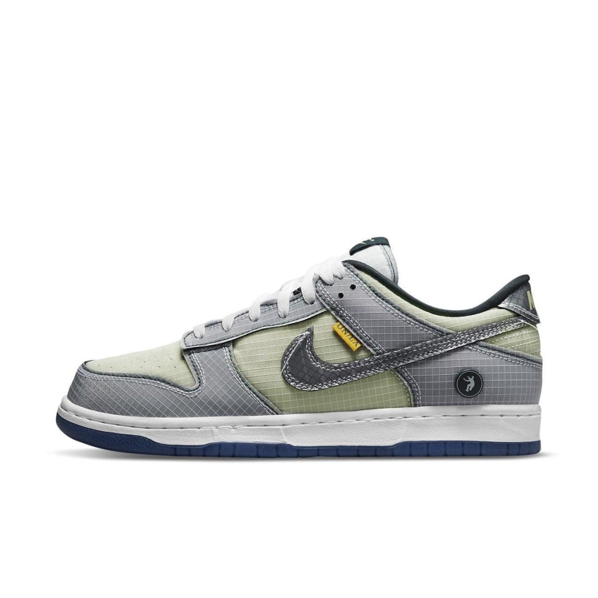 Nike Dunk Low Union Passport Pack Pistachio sneaker with gray and green details, side view.
