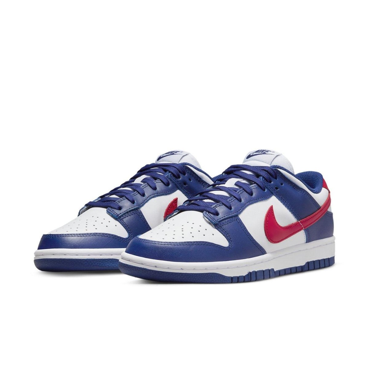 Nike Dunk Low USA Women's sneakers featuring white base, blue overlays, and red Swoosh.