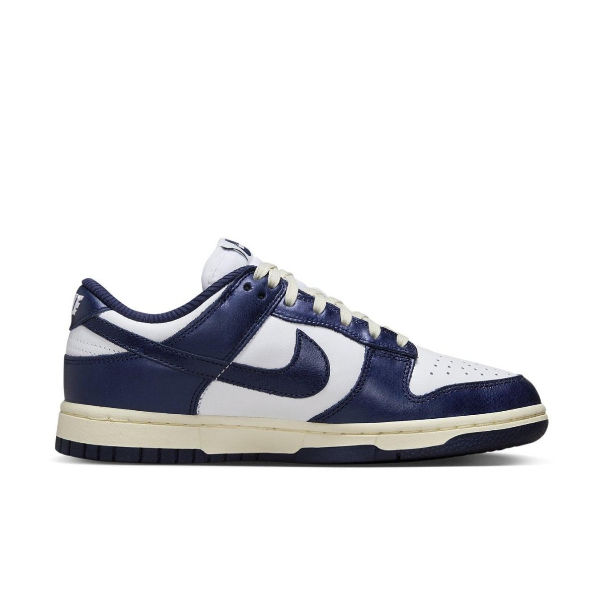 Nike Dunk Low Vintage Navy for women, featuring a white leather base and deep navy overlays.