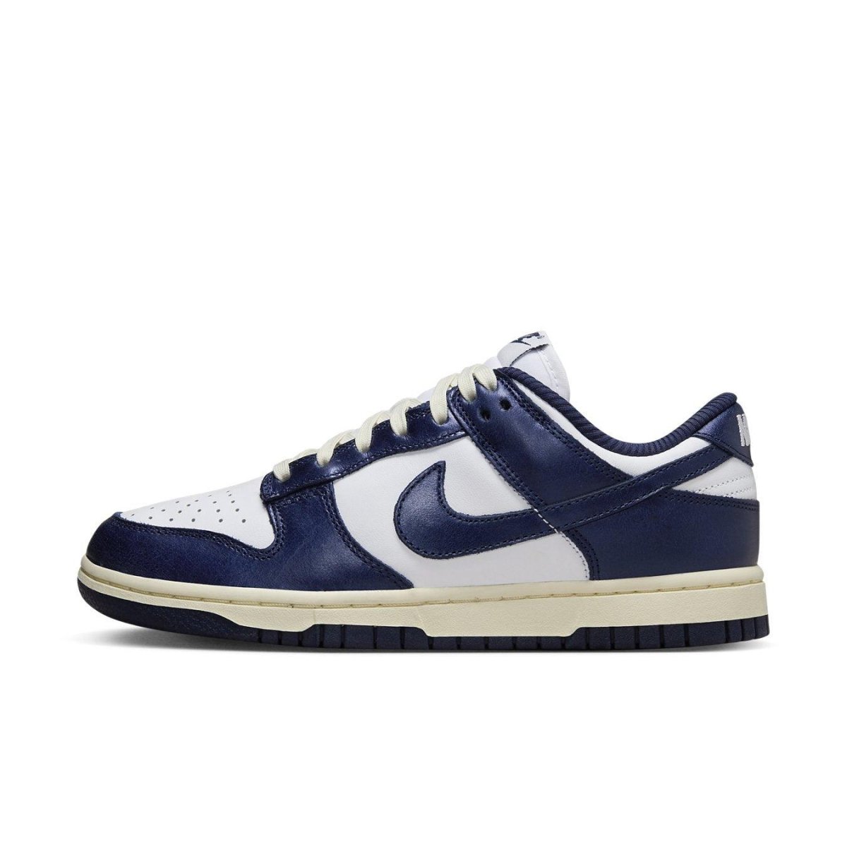 Nike Dunk Low Vintage Navy for women features white leather with deep navy accents and classic Swoosh design.