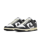 Nike Dunk Low Vintage Panda women’s sneakers featuring black and white leather with vintage ivory sole.