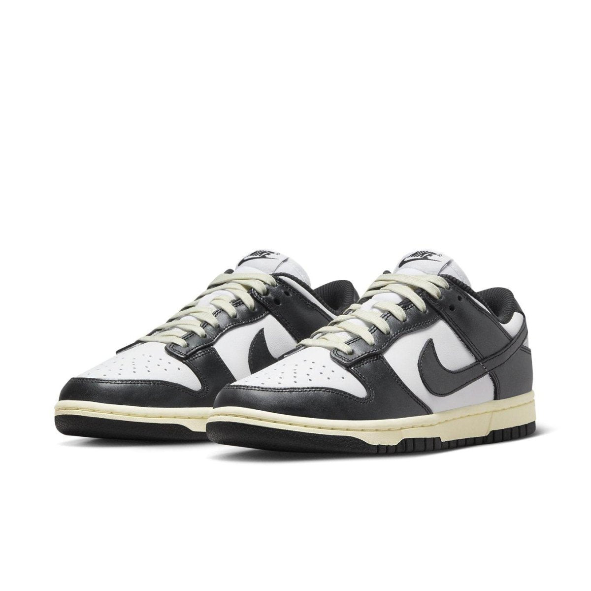 Nike Dunk Low Vintage Panda women’s sneakers featuring black and white leather with vintage ivory sole.
