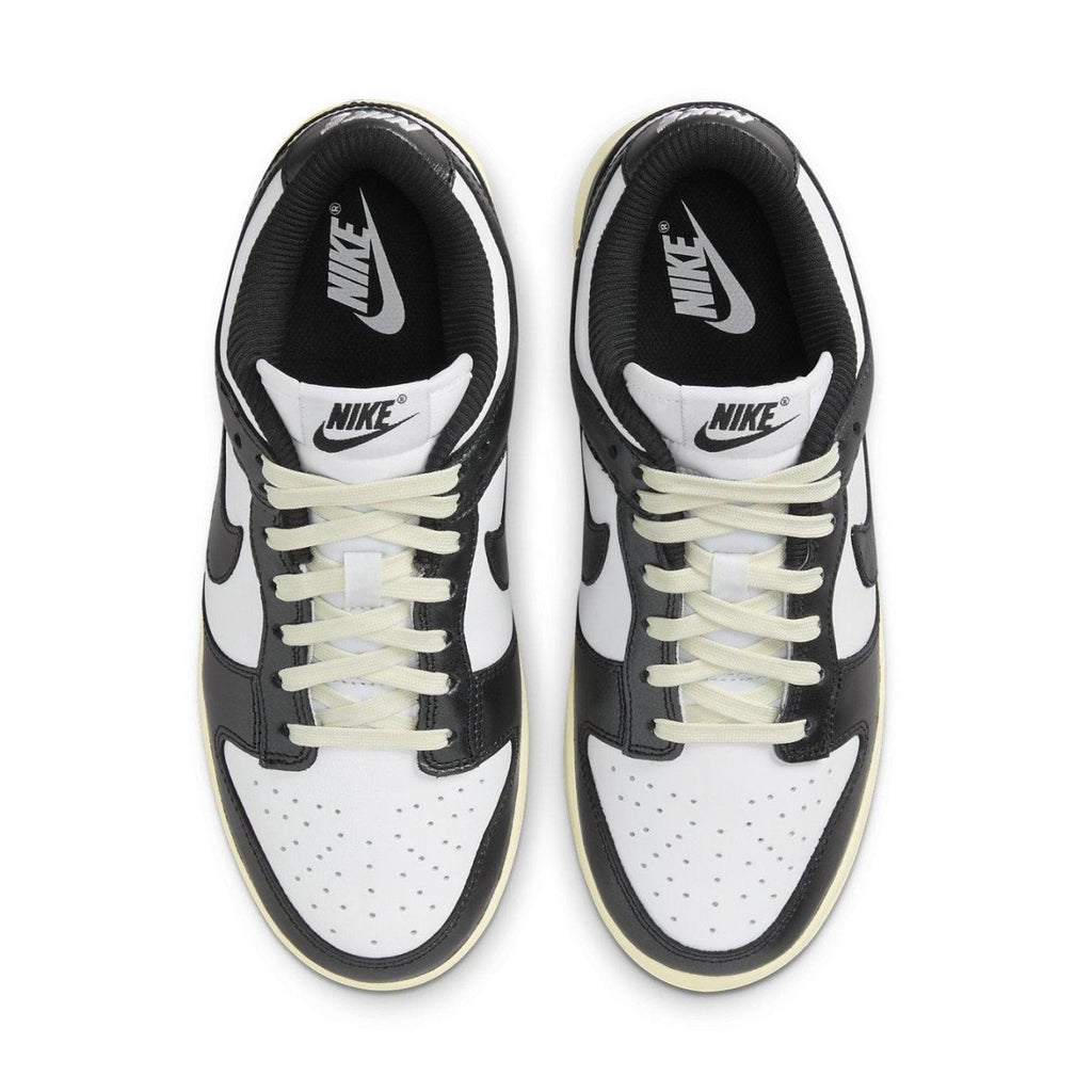 Nike Dunk Low Vintage Panda women's sneakers in black and white with vintage ivory sole.