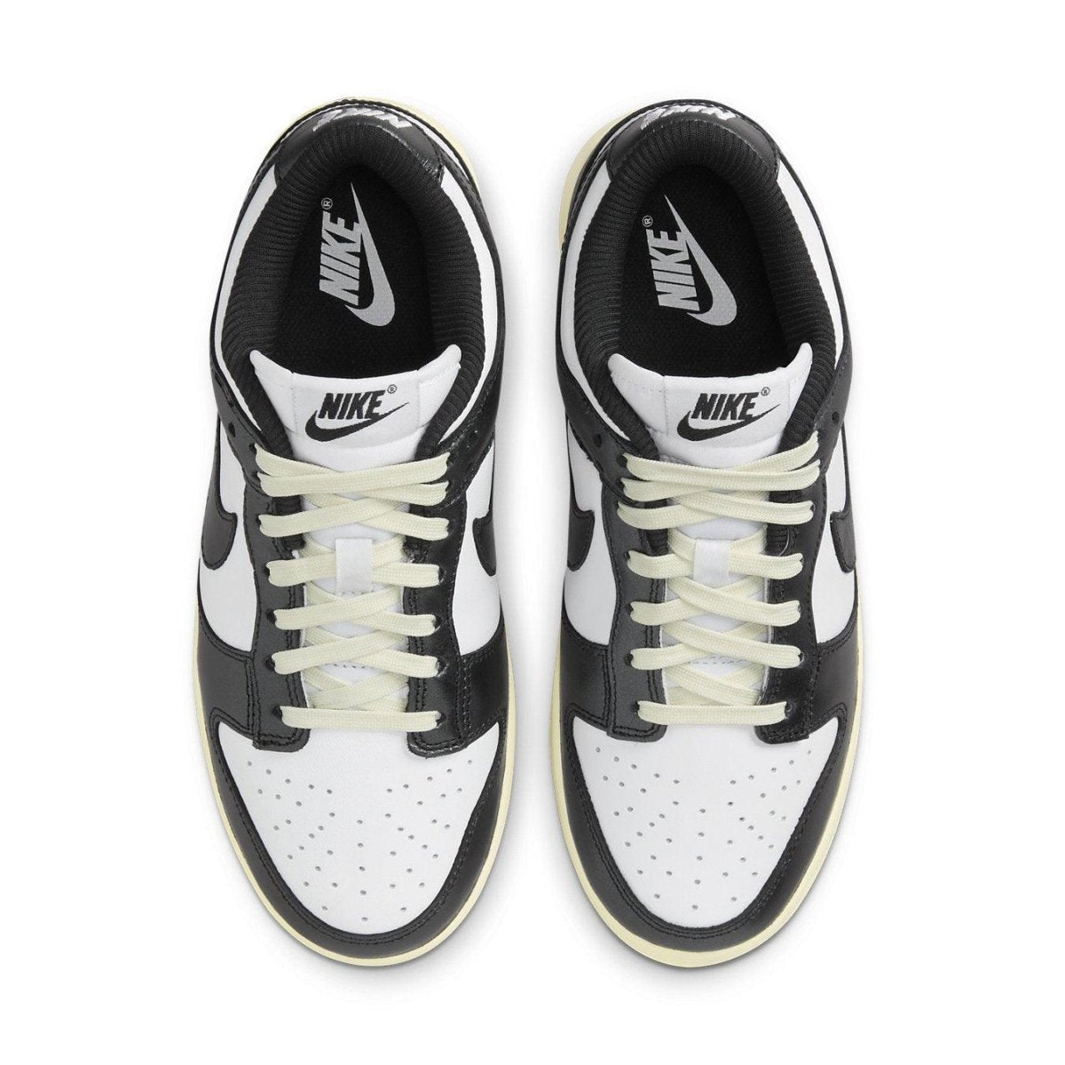 Nike Dunk Low Vintage Panda women's sneakers in black and white with vintage ivory sole.