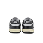 Nike Dunk Low Vintage Panda women's sneakers, showing the back view with black and ivory tones.