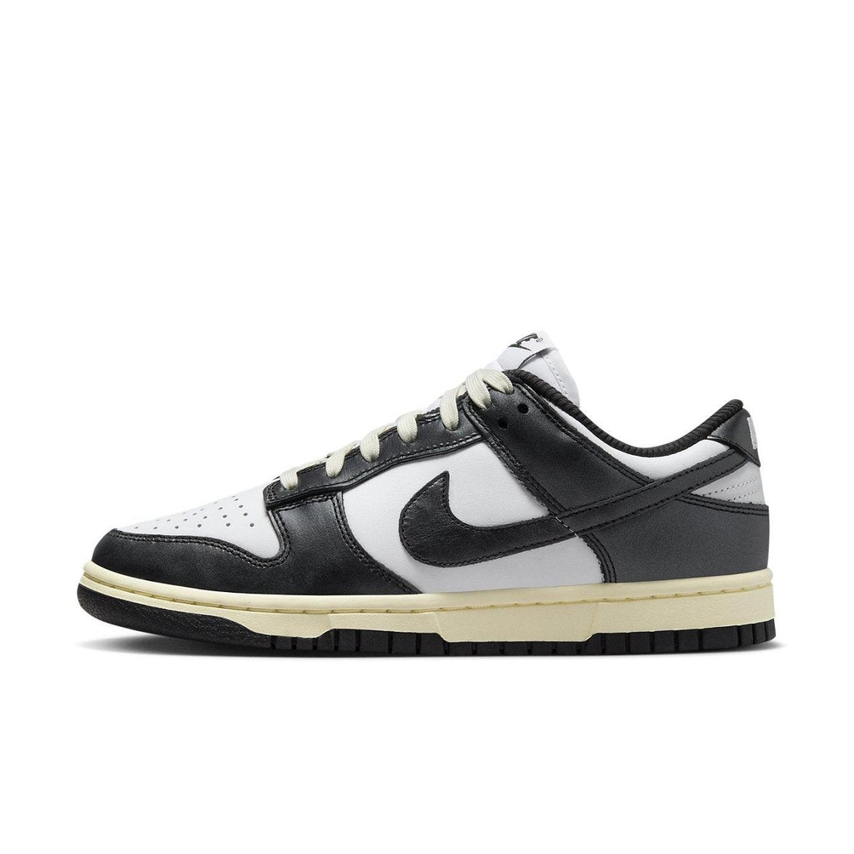 Nike Dunk Low Vintage Panda women's sneaker in black and white with vintage ivory sole.