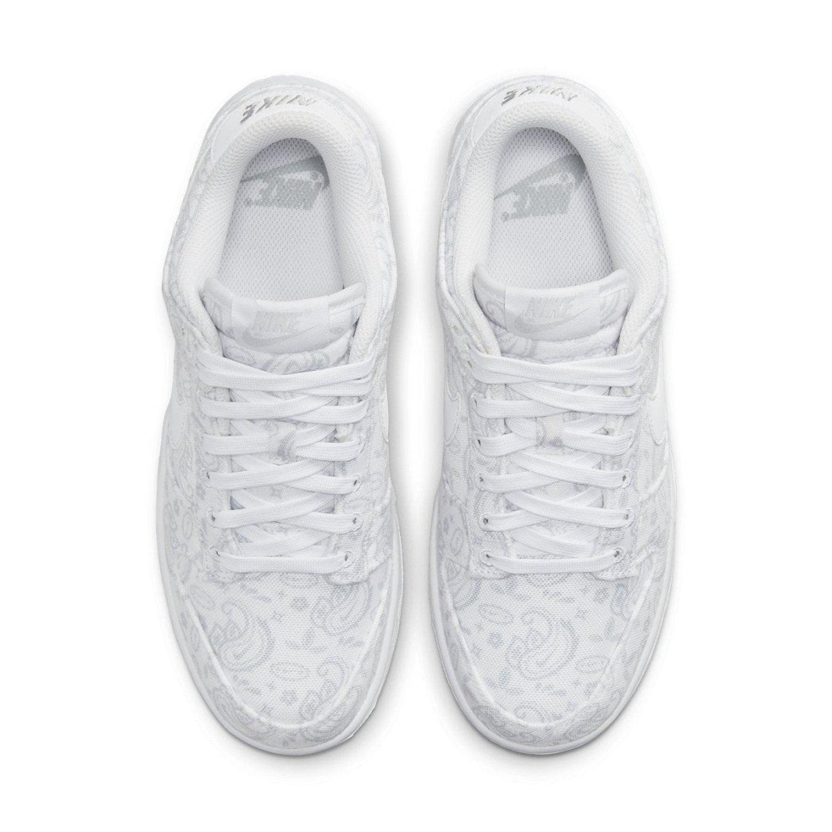 Nike Dunk Low White Paisley (W) sneaker featuring a white fabric upper with light gray paisley patterns.