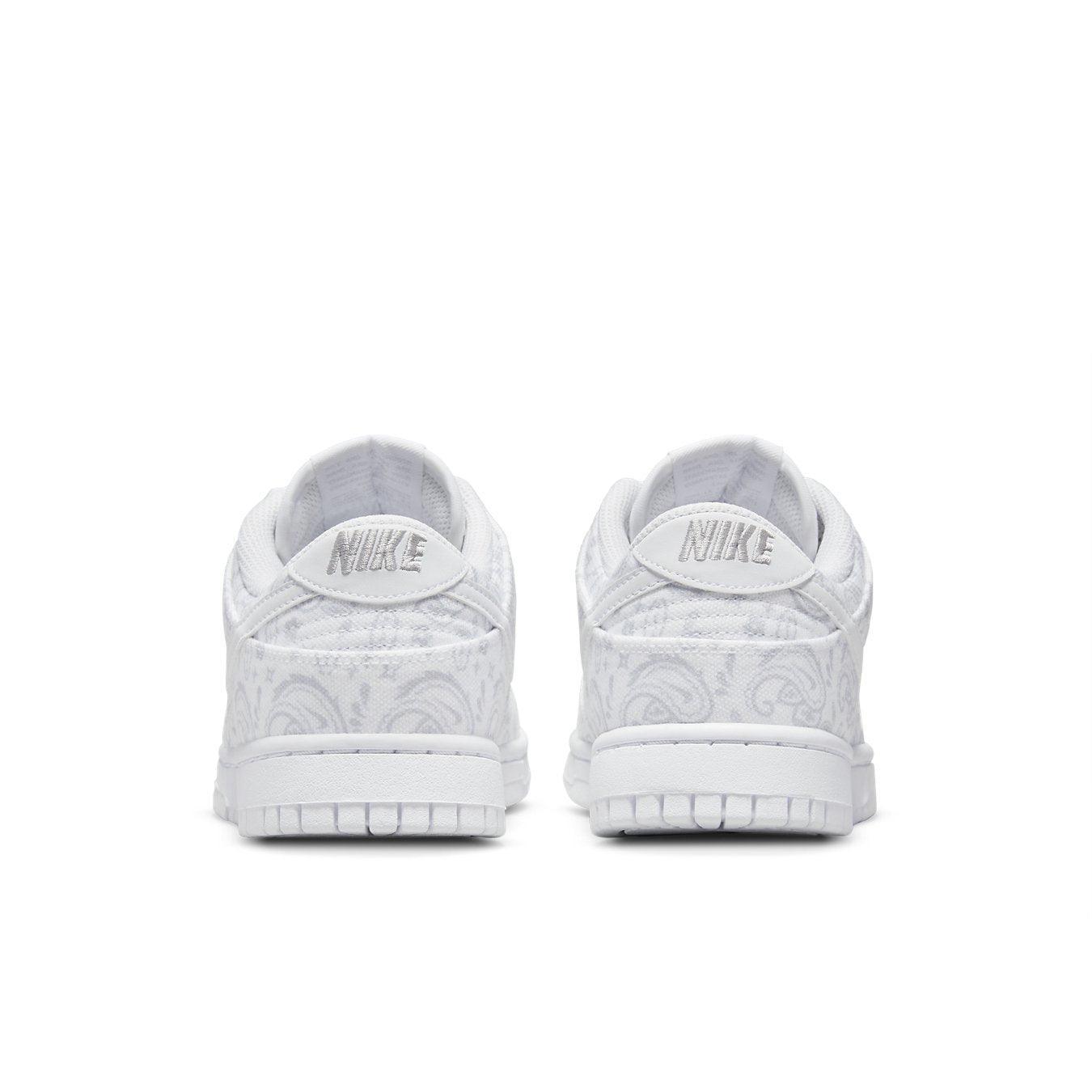 Back view of Nike Dunk Low White Paisley sneakers showcasing white paisley pattern and Nike branding.