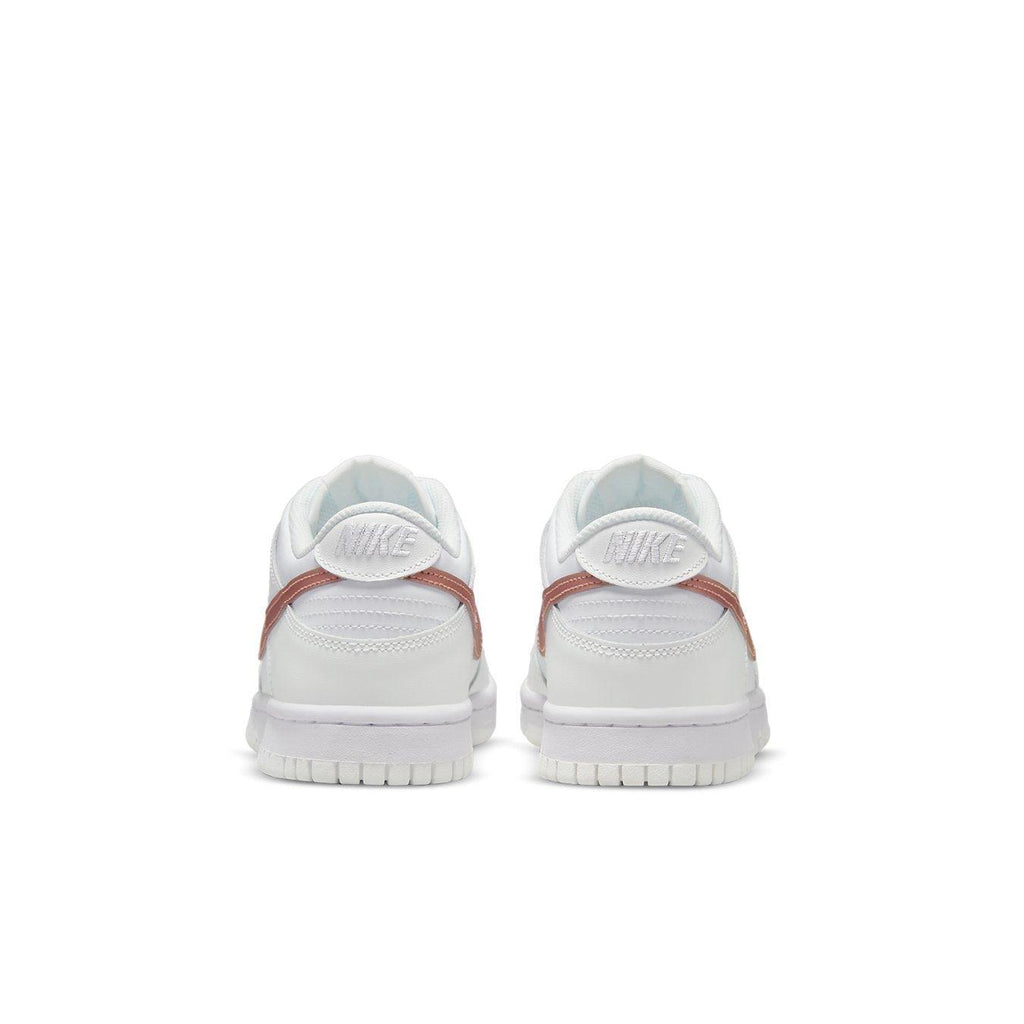 Nike Dunk Low White Pink (GS) sneaker rear view showcasing sleek design and padded collar.