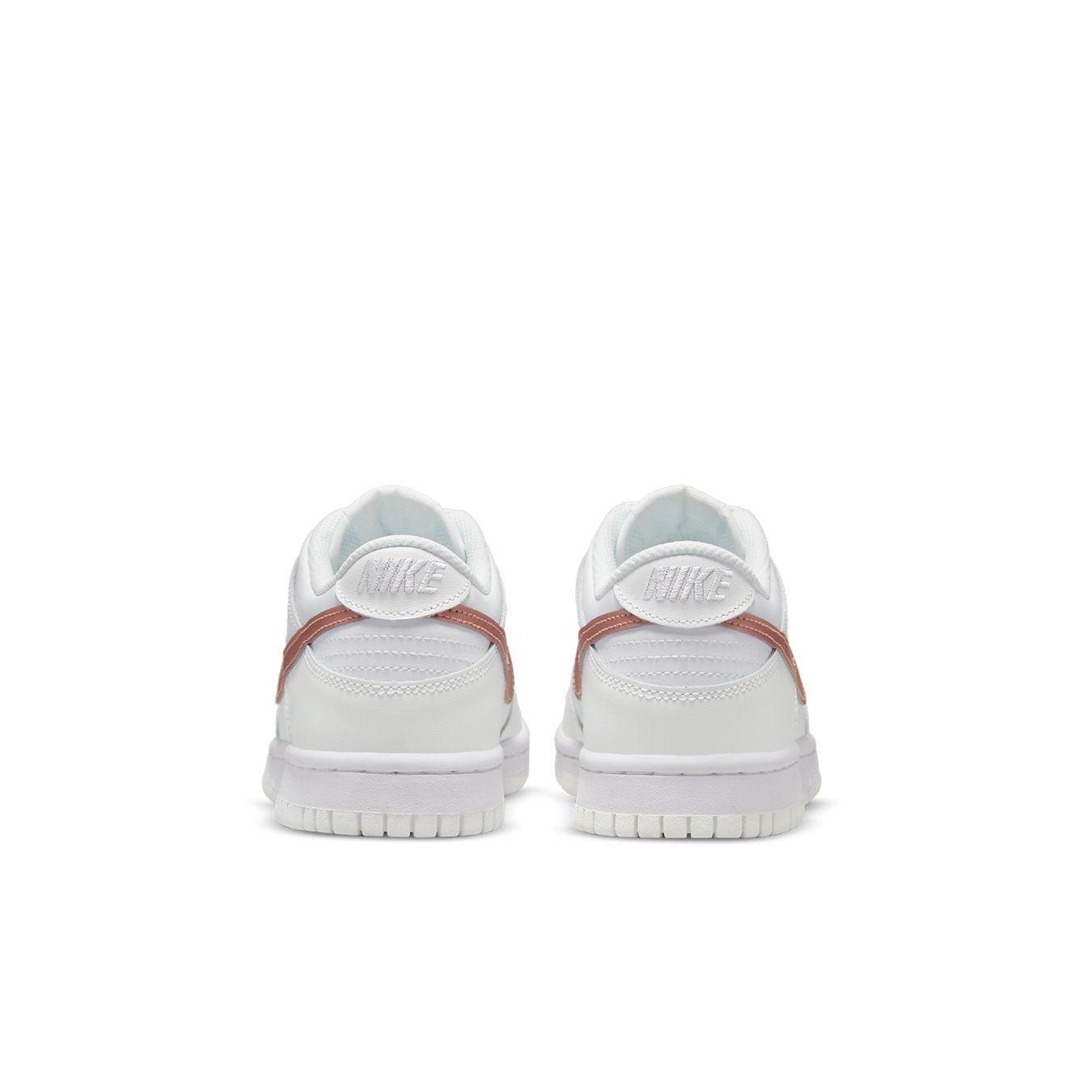 Nike Dunk Low White Pink (GS) sneaker rear view showcasing sleek design and padded collar.