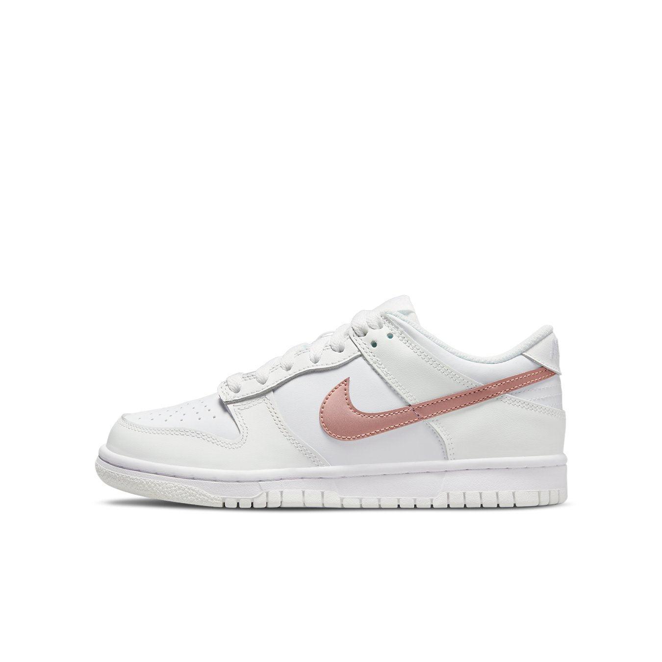 Nike Dunk Low White Pink (GS) sneaker featuring leather upper and bronze Swoosh, ideal for everyday wear.