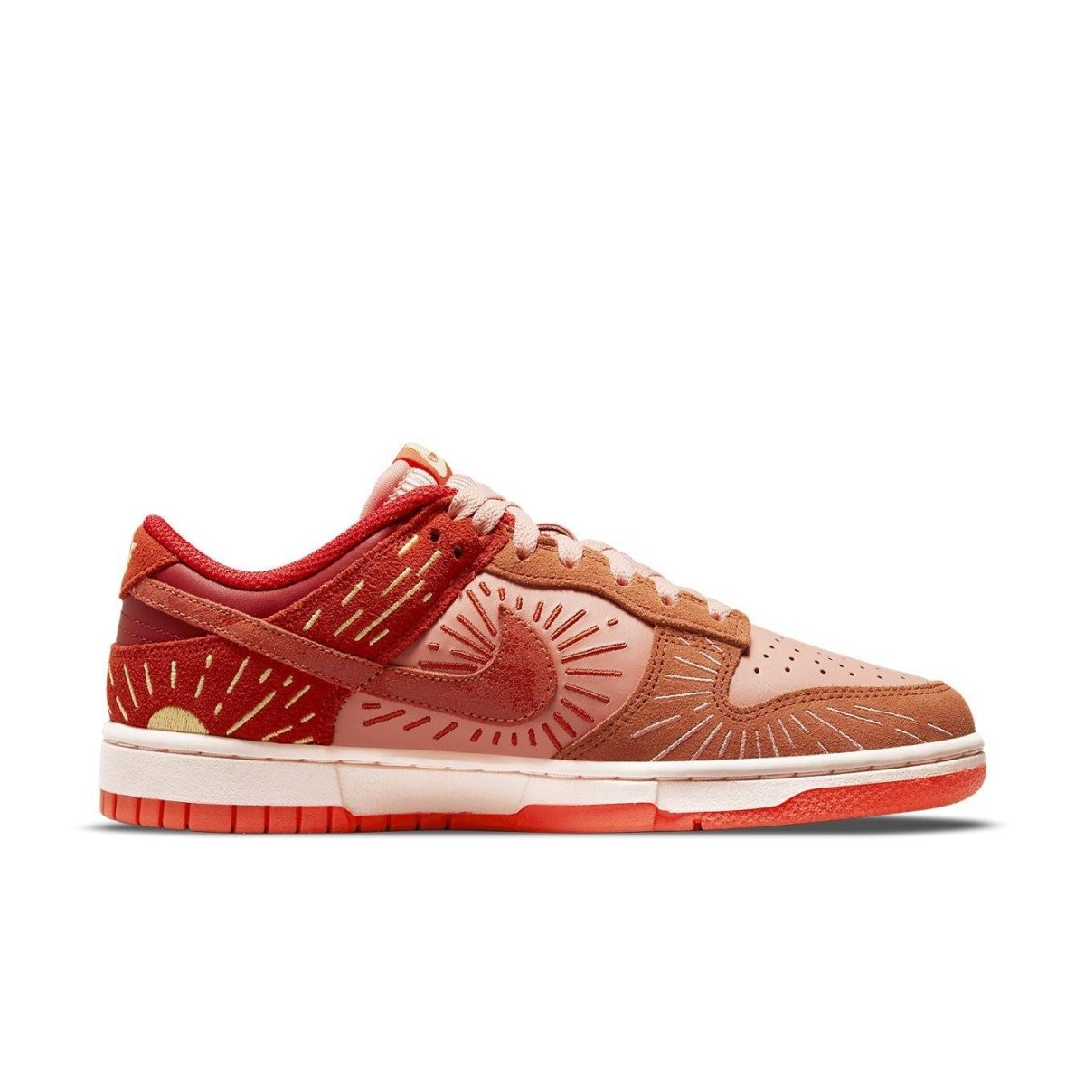 Nike Dunk Low Winter Solstice women's sneakers in pink, burnt orange, and scarlet with sunray designs.
