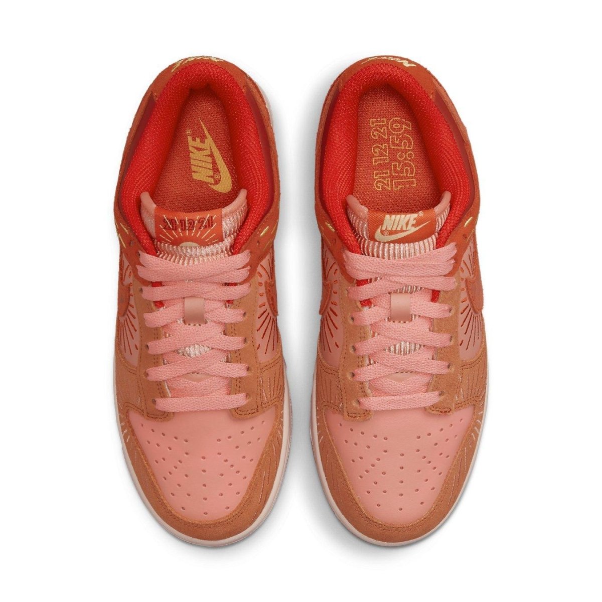 Nike Dunk Low Winter Solstice women's sneakers in pink and burnt orange with radiant stitching details.
