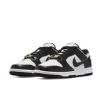 Nike Dunk Low World Champs in black and white with gold details for a luxurious look.