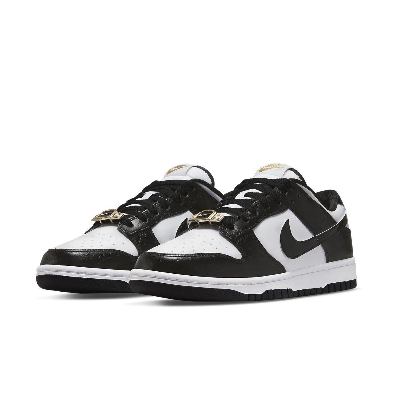 Nike Dunk Low World Champs in black and white with gold details for a luxurious look.