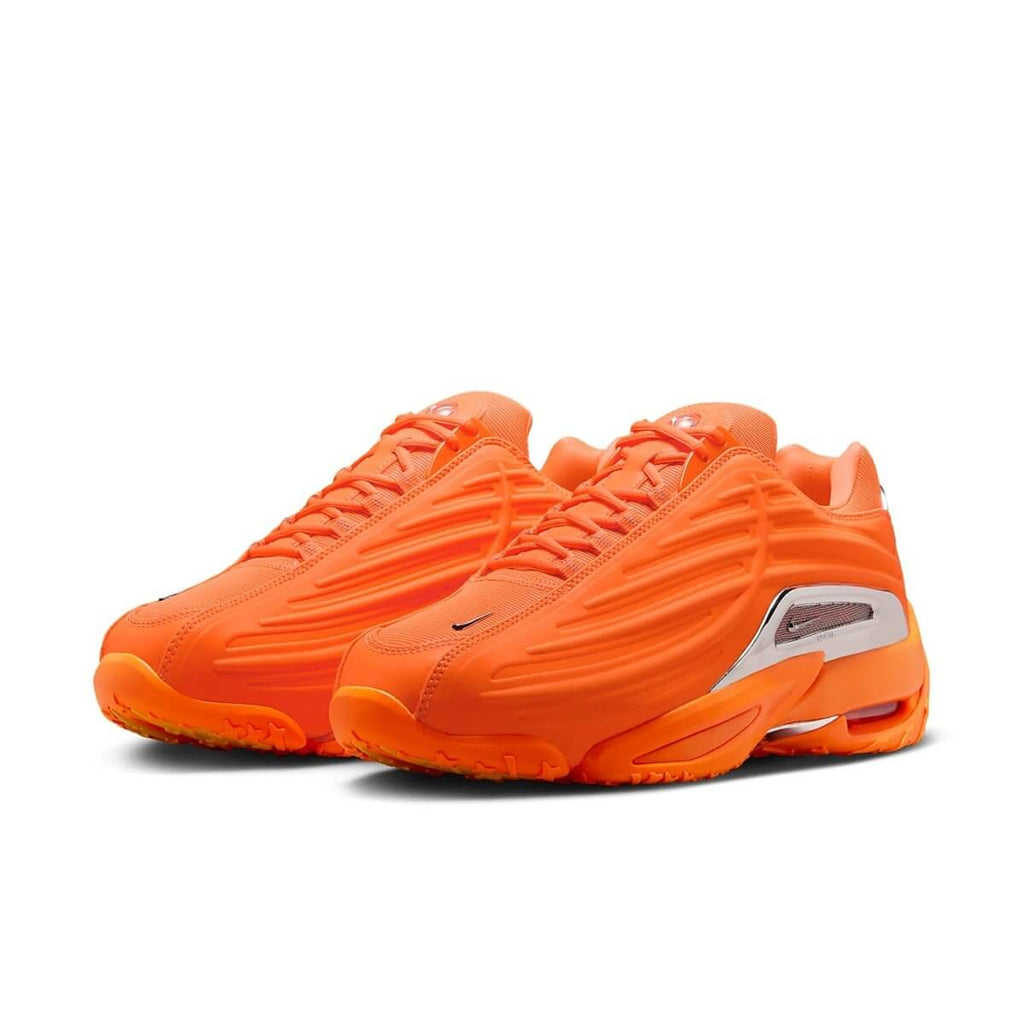 Nike Hot Step 2 Drake NOCTA in bold Total Orange with modern design and reflective finish.