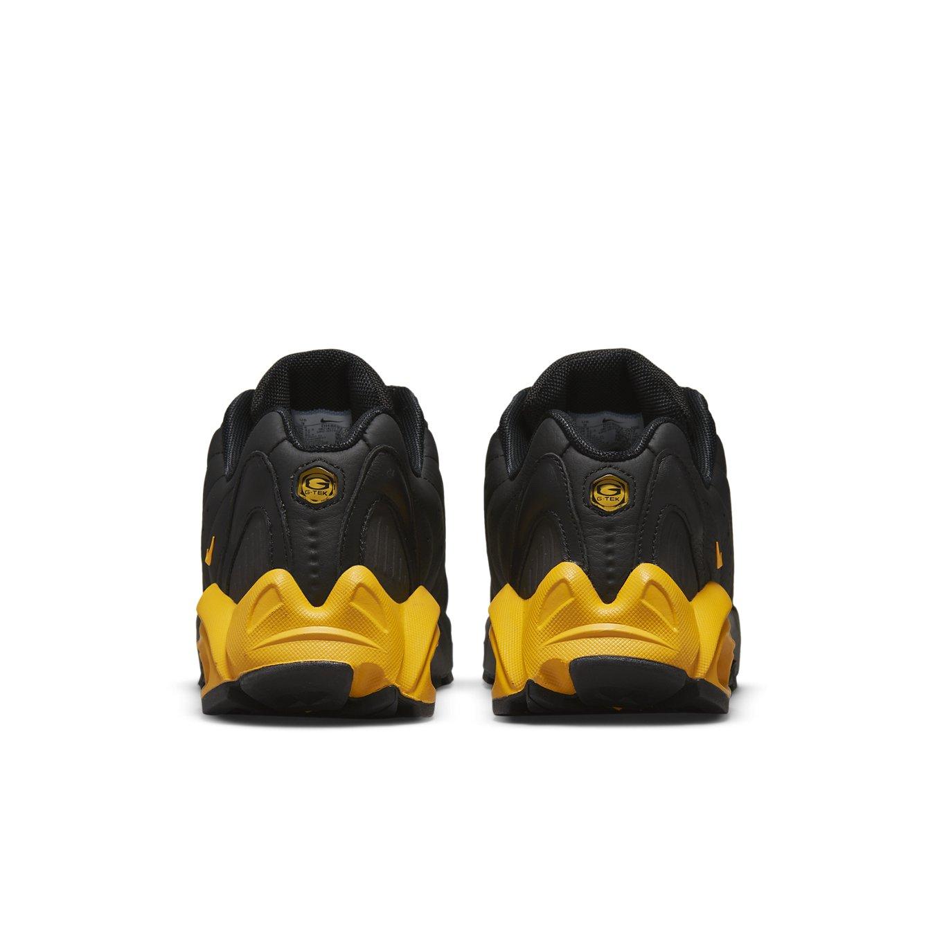 Nike Hot Step Air Terra Drake NOCTA black and yellow sneaker, back view showcasing unique design elements.