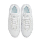 Nike Hot Step Air Terra Drake NOCTA White sneakers featuring a clean white leather upper and decorative side perforations.