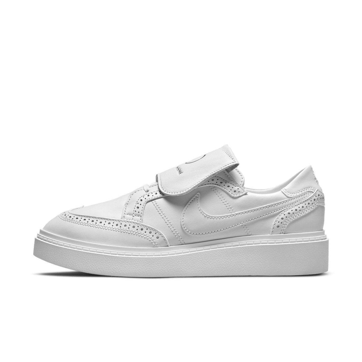 Nike Kwondo 1 G-Dragon Peaceminusone Triple White side view with leather upper and brogue details.