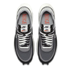 Nike LD Waffle Sacai Black sneakers featuring dual tongues and co-branded Nike x Sacai logo.