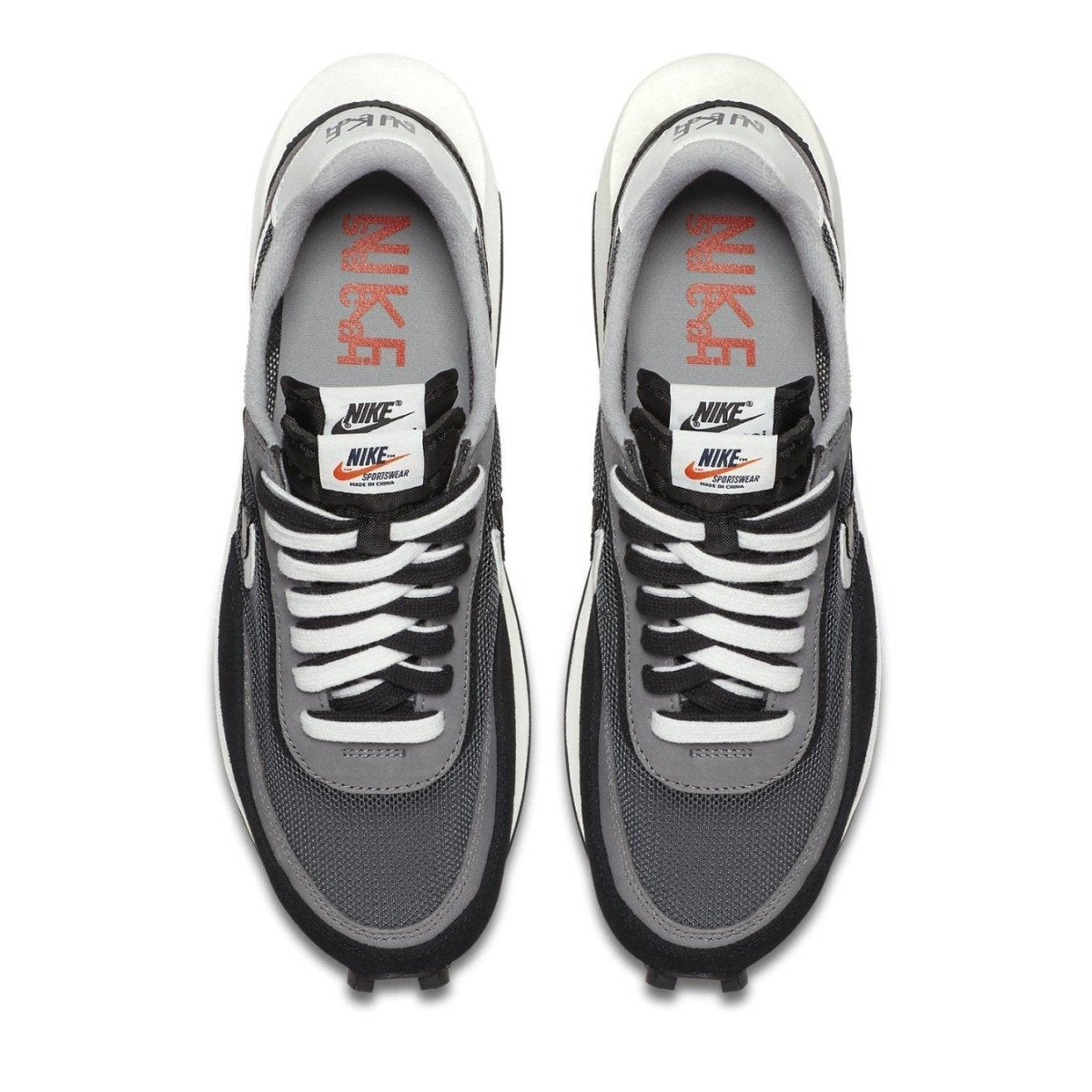 Nike LD Waffle Sacai Black sneakers featuring dual tongues and co-branded Nike x Sacai logo.